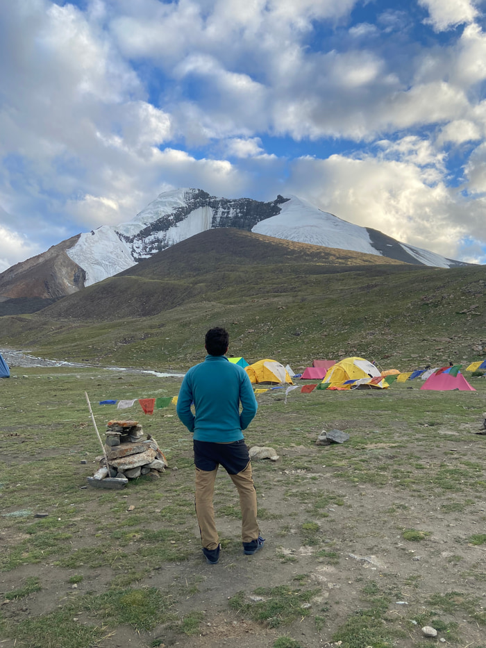 Base camp tents and prayer flags below Kang Yatse II.