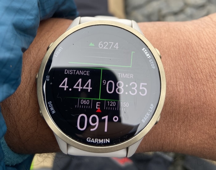 A Garmin watch at the Kang Yatse II summit showing a 6,274 metre altitude reading.